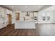 Modern kitchen featuring a large center island, stainless steel appliances, and ample cabinet space at 24708 E 40Th Ave, Aurora, CO 80019