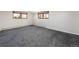 Spacious basement area with plush carpeting, natural light, and potential for customization at 26 Morningside Dr, Wheat Ridge, CO 80215