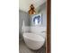 Modern bathroom features a freestanding tub, unique light fixture, and graphic flooring at 26 Morningside Dr, Wheat Ridge, CO 80215