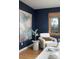 Cozy bedroom corner with natural light, stylish decor, a comfortable chair, and artistic accents at 26 Morningside Dr, Wheat Ridge, CO 80215