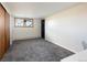 Bedroom with closet, window, and neutral tones at 26 Morningside Dr, Wheat Ridge, CO 80215