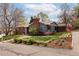 Charming single-Gathering home featuring a well-manicured lawn and a combination of brick and siding exterior at 26 Morningside Dr, Wheat Ridge, CO 80215