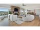 Stylish living room with a cozy fireplace, hardwood floors, and mountain views at 26 Morningside Dr, Wheat Ridge, CO 80215