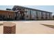 Modern building exterior featuring large windows and brick accents at 6153 N Ceylon St # 205, Denver, CO 80249