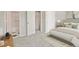 Cozy bedroom with a serene ambiance, carpet floors, and a view to the bathroom at 4574 S Cimmarron Cir # B, Aurora, CO 80015