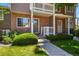 Charming townhouse with brick facade, manicured lawn and a 'Welcome' sign at 4574 S Cimmarron Cir # B, Aurora, CO 80015