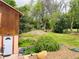 Lush backyard features mature trees, garden beds, and a well-maintained lawn at 8211 Rocky Mountain Dr, Lakewood, CO 80214