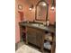Bathroom featuring rustic vanity with integrated sink and stylish decor at 8211 Rocky Mountain Dr, Lakewood, CO 80214