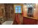 Unique bathroom features rustic wood accents, colorful decor, and bright fixtures at 8211 Rocky Mountain Dr, Lakewood, CO 80214