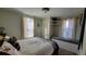 Inviting bedroom with built in shelves and window seat, neutral tones, and a queen-sized bed at 8211 Rocky Mountain Dr, Lakewood, CO 80214