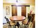 Dining room features stylish industrial decor, modern lighting, and unique barn door accents at 8211 Rocky Mountain Dr, Lakewood, CO 80214