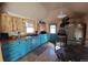 Cozy kitchen with light wood cabinets, butcher block countertops, and stainless steel appliances at 8211 Rocky Mountain Dr, Lakewood, CO 80214