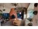 Cozy living room features a unique fireplace, comfortable seating, and plenty of natural light at 8211 Rocky Mountain Dr, Lakewood, CO 80214