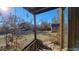 A view from the front porch of the backyard showcasing a quaint storage shed and outdoor space at 8211 Rocky Mountain Dr, Lakewood, CO 80214