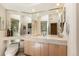 Bathroom vanity with large mirror and a toilet at 400 S Steele St # 13, Denver, CO 80209