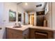 Vintage bathroom featuring dual sinks, and a walk in shower with glass door at 400 S Steele St # 13, Denver, CO 80209