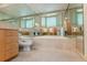 Luxurious bathroom featuring a large mirror and tiled tub at 400 S Steele St # 13, Denver, CO 80209