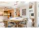 Dining room features white round table, four chairs, and natural light at 400 S Steele St # 13, Denver, CO 80209