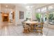 Bright breakfast nook with a round table, seating for four, and access to the outdoor patio at 400 S Steele St # 13, Denver, CO 80209