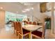 Bright dining room with a large table, seating for eight, and access to other rooms at 400 S Steele St # 13, Denver, CO 80209
