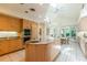 Bright kitchen features a central island with granite countertops, oven, and a seating area at 400 S Steele St # 13, Denver, CO 80209
