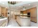 Gourmet kitchen with modern appliances, custom cabinetry, and a large center island at 400 S Steele St # 13, Denver, CO 80209
