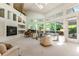 Sophisticated living room with natural light, piano and built-in shelving at 400 S Steele St # 13, Denver, CO 80209