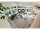 Bright open-concept living room with a piano, comfortable seating, and backyard access at 400 S Steele St # 13, Denver, CO 80209