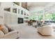 Spacious living room featuring high ceilings, large windows, and a cozy fireplace at 400 S Steele St # 13, Denver, CO 80209