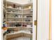Walk-in pantry with ample shelving for storing food, dishes, and kitchen supplies at 400 S Steele St # 13, Denver, CO 80209