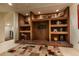 Close-up on the shelving unit in the living room with unique decor at 400 S Steele St # 13, Denver, CO 80209