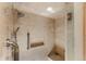 Modern tiled shower with grab bars and a built-in niche at 400 S Steele St # 13, Denver, CO 80209