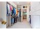 Well-organized walk-in closet with ample storage and a view into a full bathroom at 400 S Steele St # 13, Denver, CO 80209