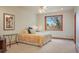 Cozy bedroom with carpeted floors and a large window at 15533 S Perry Park Rd, Palmer Lake, CO 80133