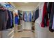 Walk-in closet with custom shelving provides ample storage at 15533 S Perry Park Rd, Palmer Lake, CO 80133