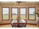 Dining room featuring scenic views, natural light, and an octagonal table at 15533 S Perry Park Rd, Palmer Lake, CO 80133