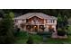 Beautifully landscaped two story home with a large balcony and outdoor space at 15533 S Perry Park Rd, Palmer Lake, CO 80133