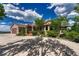 Luxurious home with a stone-accented exterior, three-car garage, and elegant landscaping creates an inviting facade at 15533 S Perry Park Rd, Palmer Lake, CO 80133
