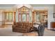 Spacious foyer with beautiful front door, staircase, and comfortable seating at 15533 S Perry Park Rd, Palmer Lake, CO 80133