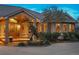 Close up of the front entrance, decorative stone exterior and well maintained landscaping at 15533 S Perry Park Rd, Palmer Lake, CO 80133