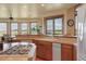 Kitchen area with breakfast bar, wood cabinets, and scenic mountain views at 15533 S Perry Park Rd, Palmer Lake, CO 80133