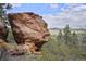 Unique rock formation atop a scenic hill, offering breathtaking views of the surrounding landscape at 15533 S Perry Park Rd, Palmer Lake, CO 80133