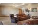 Inviting living room is carpeted and has neutral paint at 15533 S Perry Park Rd, Palmer Lake, CO 80133