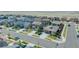 Aerial view showcases a neighborhood with various homes, green spaces, and curved streets under a sunny sky at 25062 E Cedar Pl, Aurora, CO 80018