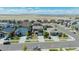 An aerial view of a residential neighborhood with well-maintained lawns and similar-style homes with a scenic vista in the background at 25062 E Cedar Pl, Aurora, CO 80018