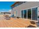 A wood deck offers outdoor seating with a view of the yard and neighborhood at 25062 E Cedar Pl, Aurora, CO 80018