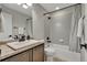Bathroom with gray accent wall, tile flooring, granite countertop and shower-tub combo at 25062 E Cedar Pl, Aurora, CO 80018