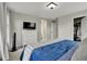 Spacious bedroom with a dresser, walk-in closet, plush carpeting, and natural light at 25062 E Cedar Pl, Aurora, CO 80018