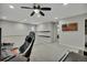 Large bonus room with neutral color scheme, ceiling fan, and doorway to another room at 25062 E Cedar Pl, Aurora, CO 80018