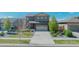 Charming two-story home with neat landscaping, a two-car garage, and a well-maintained front lawn at 25062 E Cedar Pl, Aurora, CO 80018